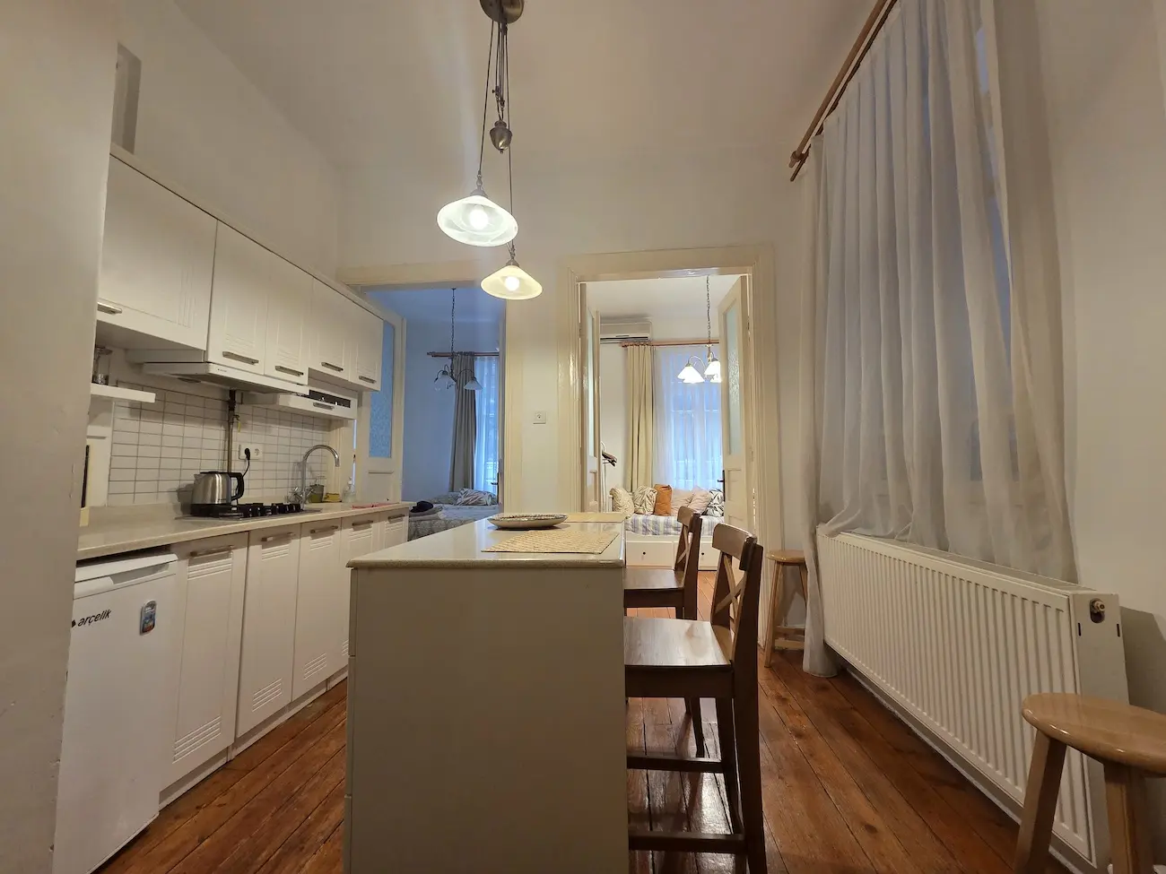 Modern kitchen interior with contemporary cabinetry and elegant finishes in a Galata apartment for sale, Istanbul.