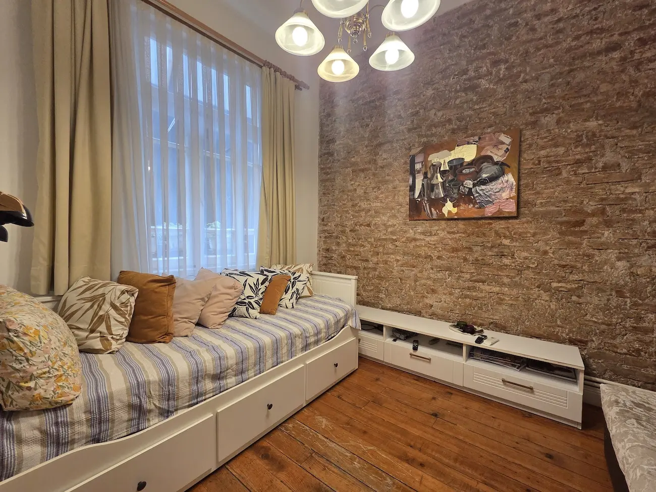 Cozy sitting area with traditional and modern elements in a resale apartment for sale in the historic Galata district, Istanbul.
