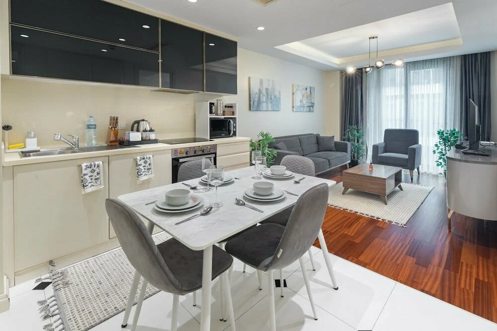 Modern fitted kitchen design with high-end appliances and sleek cabinetry in a Beyoğlu apartment, Istanbul.