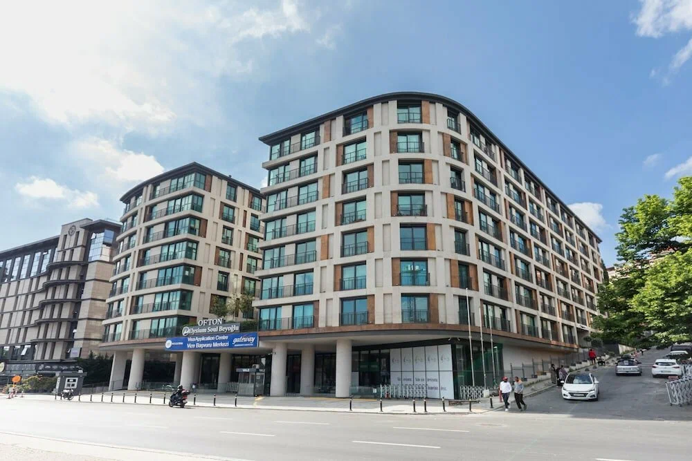 Luxury residential building facade with modern architectural design and premium finishes for sale in the Beyoğlu district, Istanbul.